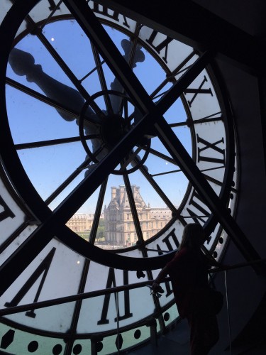 View of Notre Dame through the clock tower window in Musee d' Orsay